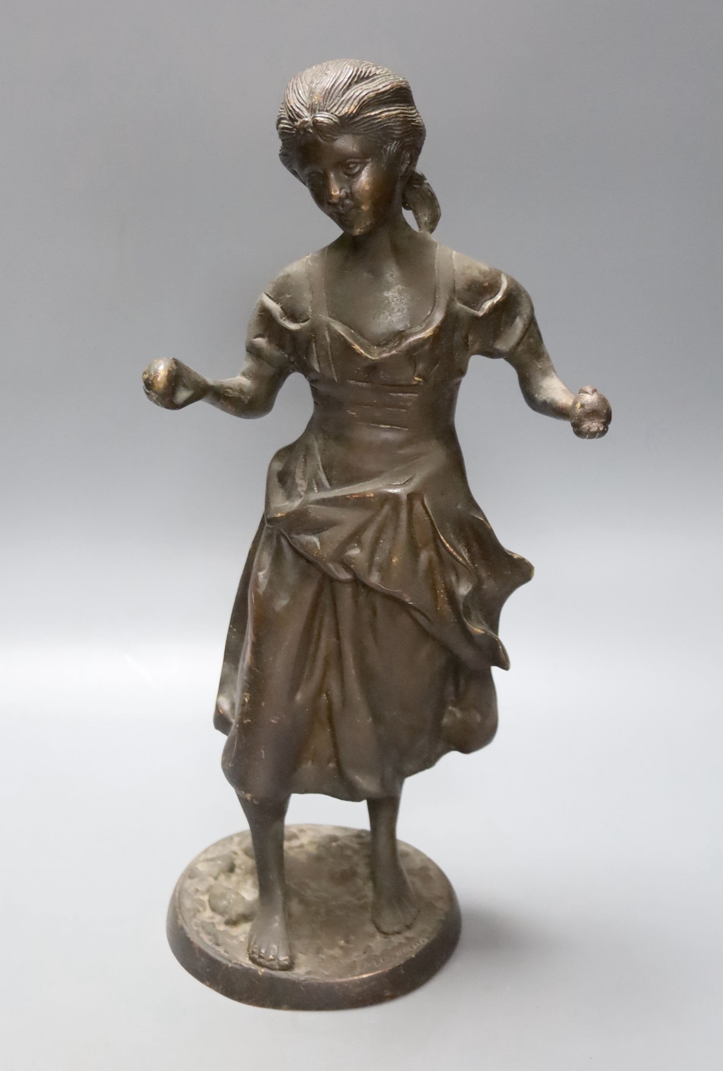 After Moreau. A bronze female figure, script signature to circular base, height 38cm